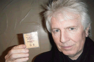 Graham Nash holds a Comets Concert Ticket from 50 years ago